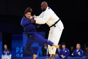 At the Olympics, a French judoka easily defeated an opponent weighing half as much